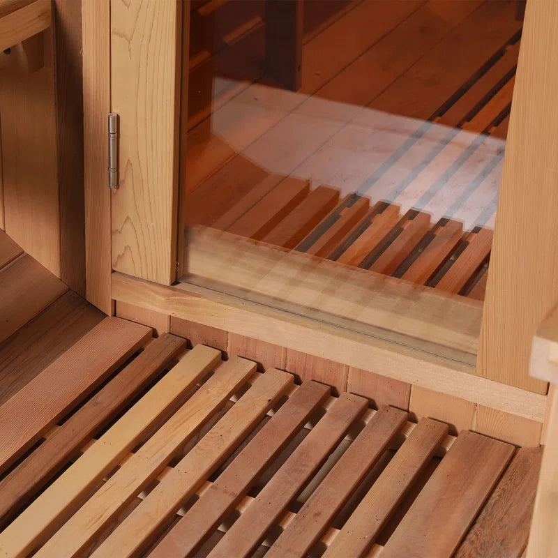 A closeup of a 6-person cedar traditional steam barrel sauna.