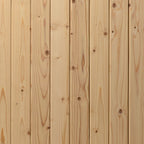 Close-up of a wooden panel with visible grain and knots.
