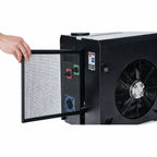 Hand opening the cover of a black power unit revealing a filter.