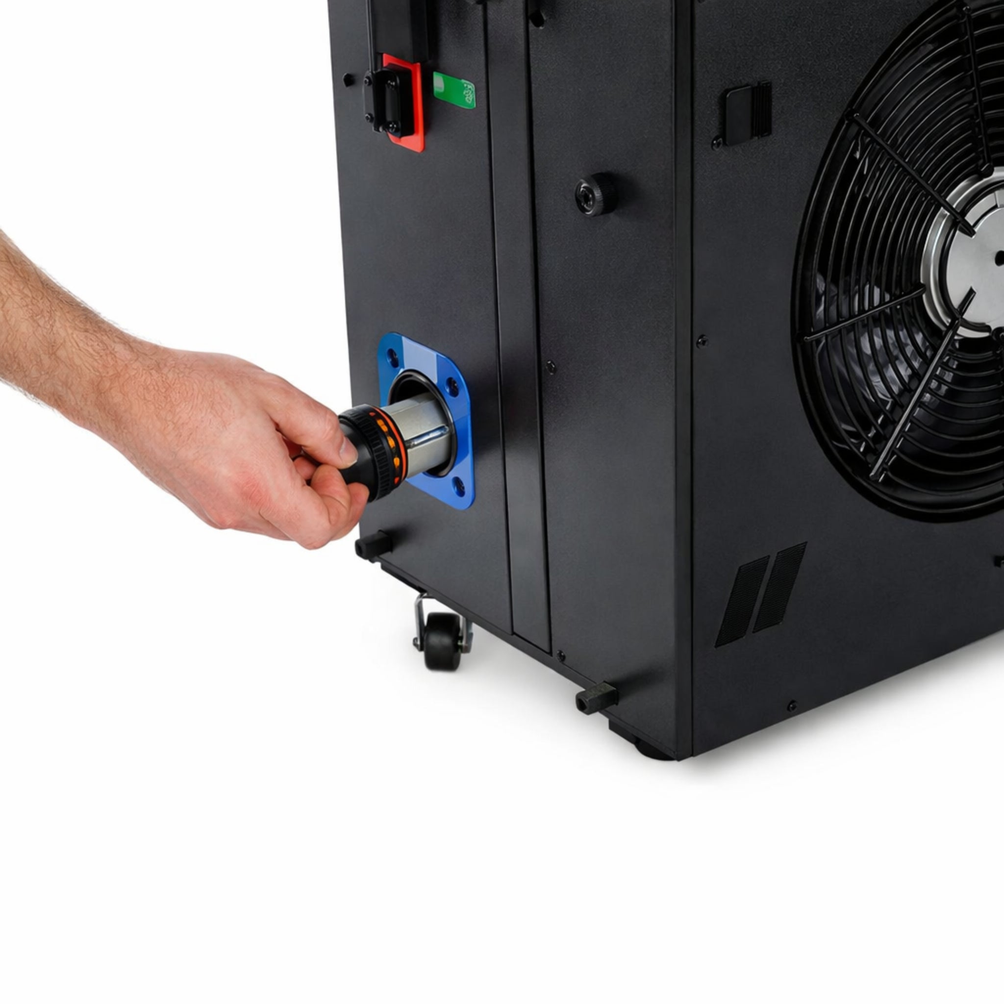 Person using a tool on a large black power unit with a fan.