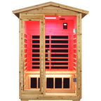 Wooden infrared sauna with red interior light on a white background.