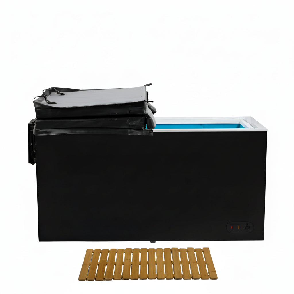Black cold plunge with plastic cover and a wooden mat on a white background.