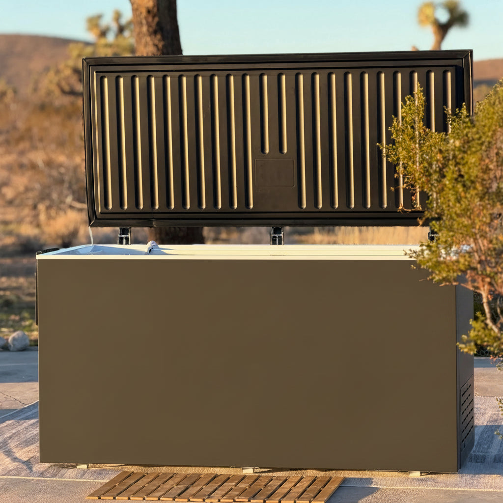 Outdoor cold plunge with lid open in a desert-like setting.