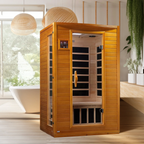 Wooden infrared sauna in a modern bathroom with a bathtub and plants.