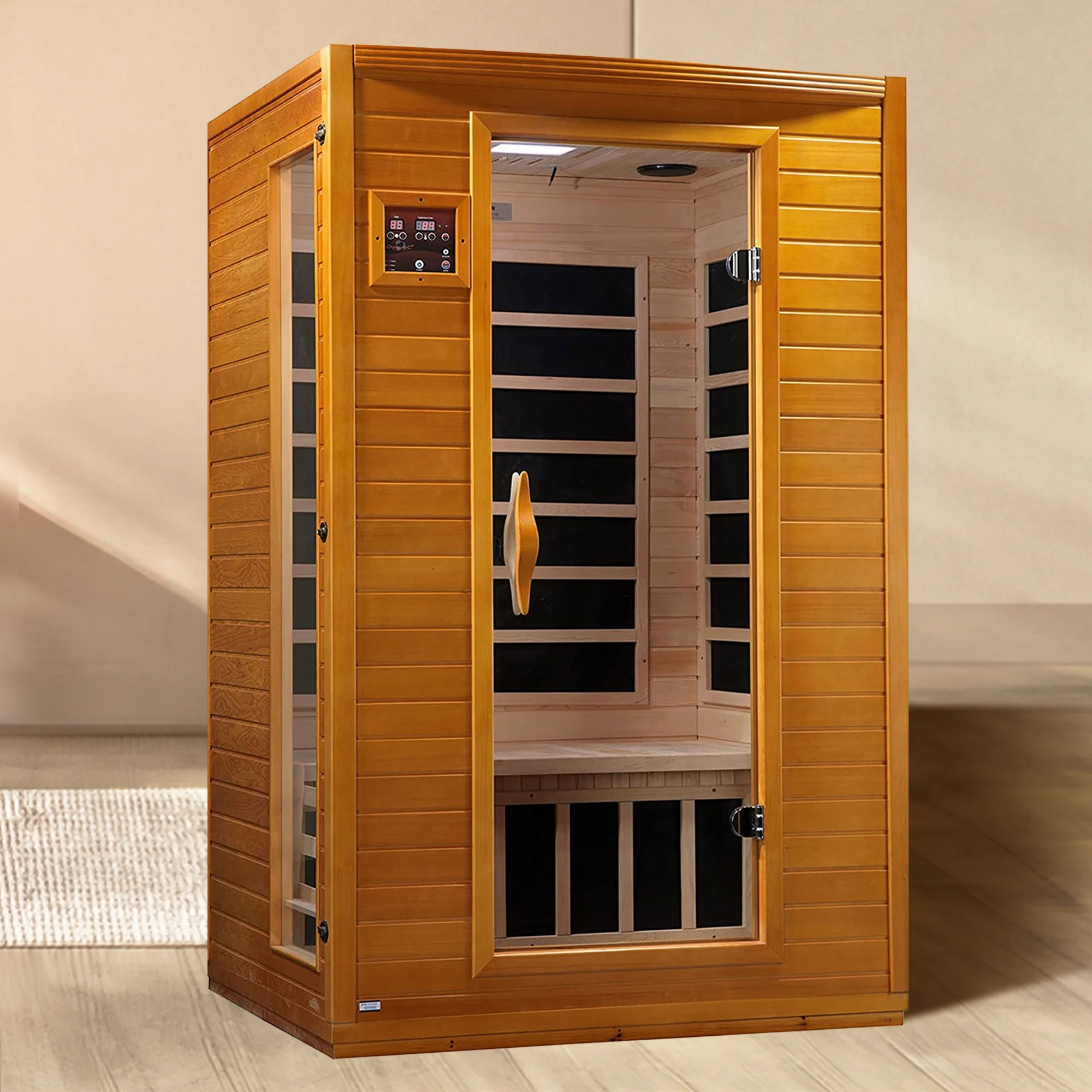 Wooden infrared sauna with glass door in a room setting.